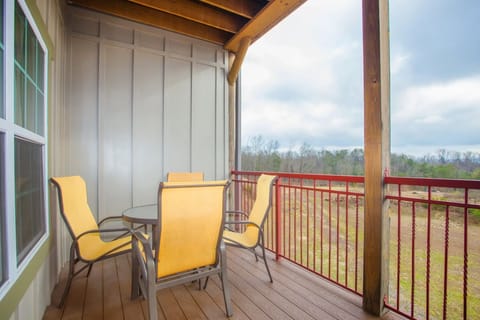Private balcony with outdoor seating and scenic views of the Smoky Mountains.