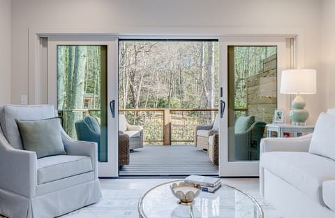 Family Room off Kitchen, with an 8 Foot Sleeper Sofa & a pair of Swivel Chairs 