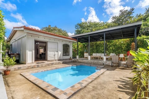 Your tropical oasis — main house, casita, and private pool.