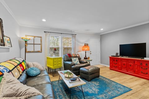 Step into color and comfort. Sink into plush seating, stream your favorites on the Smart TV, and soak in the colorful charm of a space designed for relaxing, gathering, and feeling right at home.
