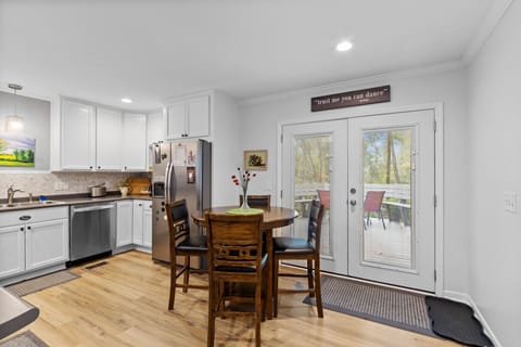 Rather eat on the back deck? Step right around the dining table and out the back door for some nature views.