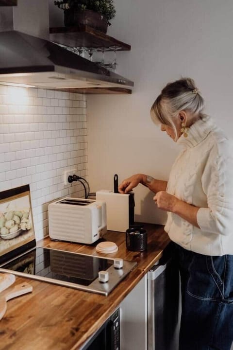 Standing in front of the kitchenette making a coffee
Photo by@love_annacritchley
