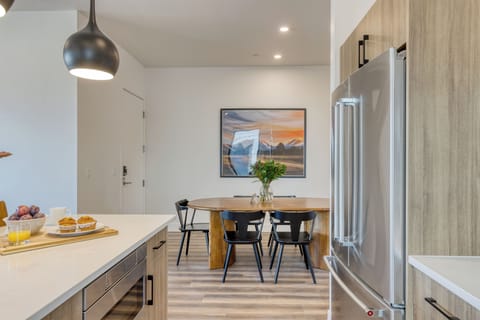 Modern kitchen with island seating and sleek finishes.