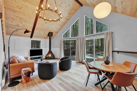 Bright A-Frame Living Room with Vaulted Ceilings & Large Windows