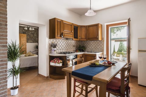 Basic Apartment, Garden View | Private kitchen | Full-size fridge, oven, stovetop, highchair