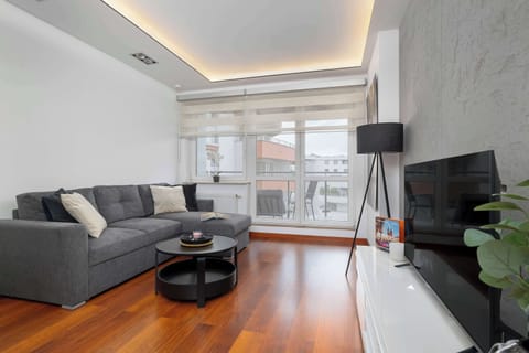 Relax in the stylish bedroom with a comfortable sofa and modern decor.