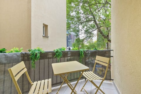 The balcony provides a perfect spot for enjoying the fresh air.