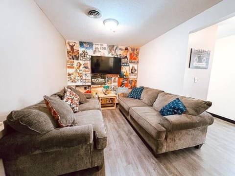 Comfy sectional & wall-to-wall art make this lounge a cozy hangout spot.