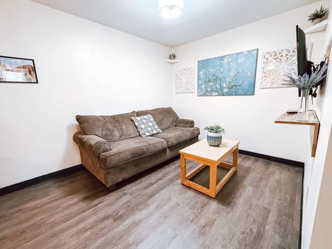 Cozy living room featuring plush seating, smart TV, and plenty of space to relax after exploring the city.