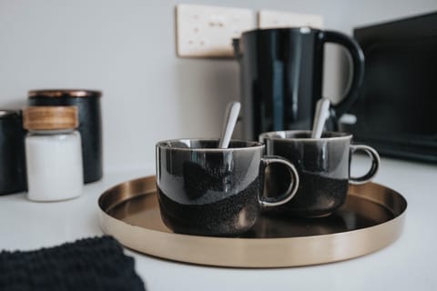 Tea & Coffee Station:
Every room includes its own hotel-style refreshment station with kettle, cups, tea, coffee, and sugar — a thoughtful touch for guests to enjoy hot drinks and unwind in comfort at any time of day.