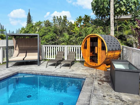 Unwind in your private outdoor oasis with pool,spa, sauna, cold plunge and shaded daybed .
