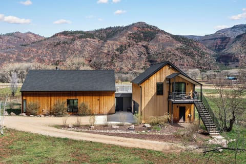 Tucked into the landscape with wide open views — quiet, private, and just far enough from it all.