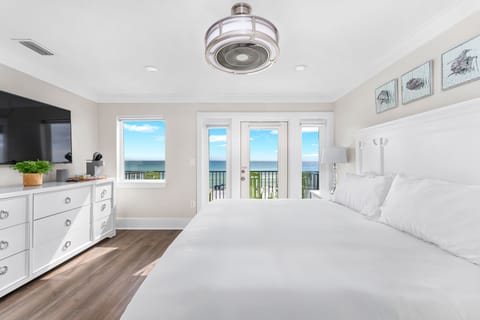 Master ensuite & private balcony w/ 4 rocking chairs, ocean views & mini Keurig.