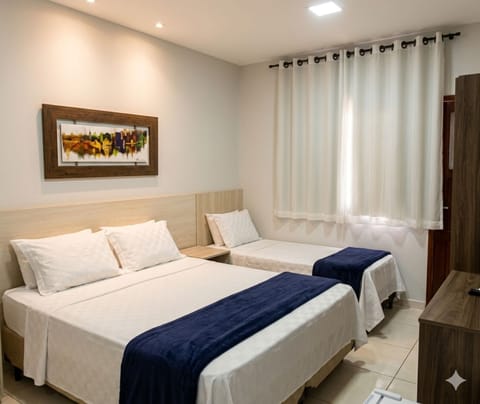 Family Room | Minibar, desk, free WiFi, bed sheets