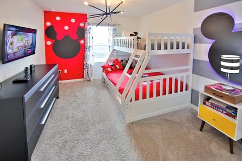 Enjoy this Mickey themed room with bunkbeds and TV. 2 twin beds, 1 full bed.
