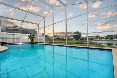 Pool | Screened-In Oasis with Lake Views & Relaxing Loungers