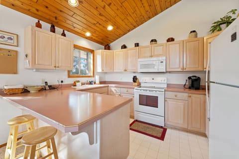 A full kitchen with bar seating for 2 | Interior