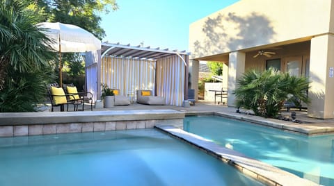 Dive into luxury in your private pool, surrounded by lush landscapes and sun umbrellas!