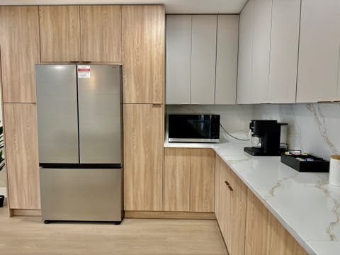 Start your day right in this cozy, light-filled kitchen equipped with all essentials and modern comforts.