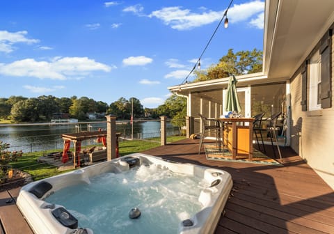 Enjoy morning coffee on the deck or a sunset soak in the hot tub with direct water access.
