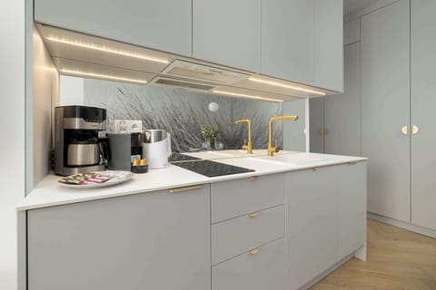 Cook and dine in style with the modern kitchenette and dining area.
