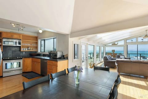 Bright, open layout with a cozy kitchen, dining space, and living area filled with ocean views. A comfortable spot to cook, gather, and relax together.