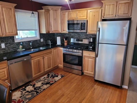 KITCHEN:  The home has a very modern kitchen with all appliances including a dishwasher.