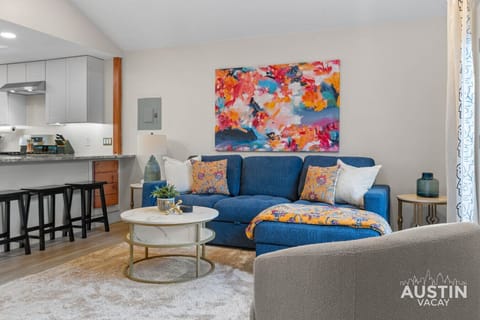 Color, comfort, and counter stools. This room’s doing the most in the best way.