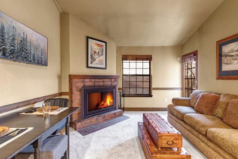 Curl up with your favorite book by the crackling fireplace in the cozy living room.
