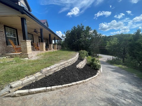 The front view with the rocking chairs on the porch