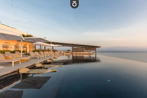 Rooftop heated pool, loungers, jacuzzi, swim up bar, sushi and cocktail lounge with sunset views