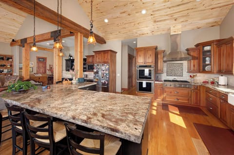 Fully stocked gourmet, chef's kitchen.