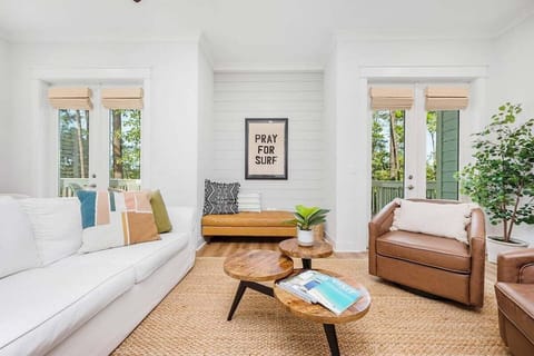 Living room space with ample seating to share in television viewing, game nights, and good conversation.