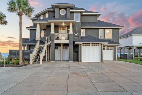 An architectural masterpiece rising from the shoreline, The Elissa House commands attention with its coastal elegance, stately design, and the promise of luxury within steps of the sea.