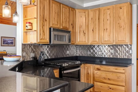 Kitchen: Main floor, Drip coffee maker, Crockpot, French press, toaster, cooking utensils, tableware