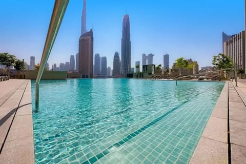 Outdoor pool, pool umbrellas, sun loungers