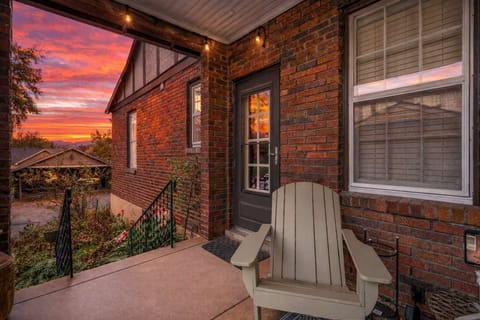 Charming front porch with cozy outdoor seating — perfect for sipping coffee or winding down at sunset