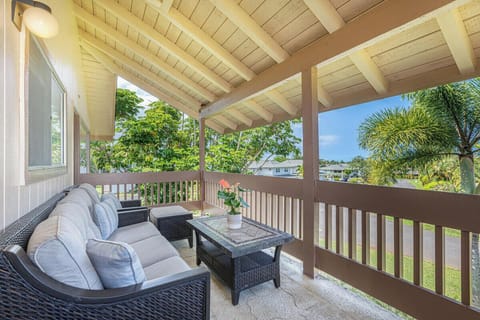 Unwind on the lanai surrounded by tropical greenery and gentle tradewinds.