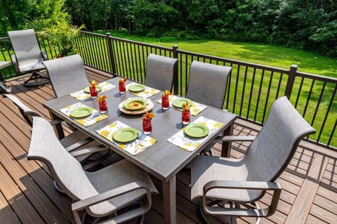 Large Deck Overlooking a Beautiful Yard and Wall of Woods