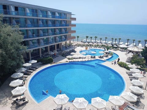 Seasonal outdoor pool, open 9:00 AM to 6:30 PM, pool umbrellas