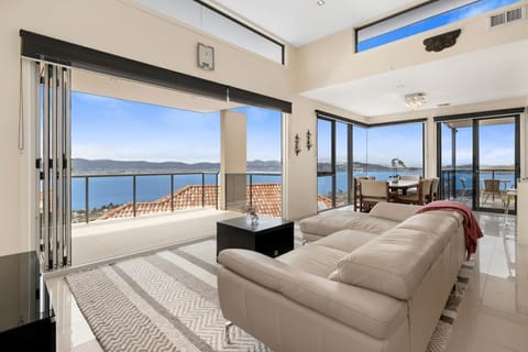 Modern leather lounges, looking out to the river. Also has a large Smart Television.
