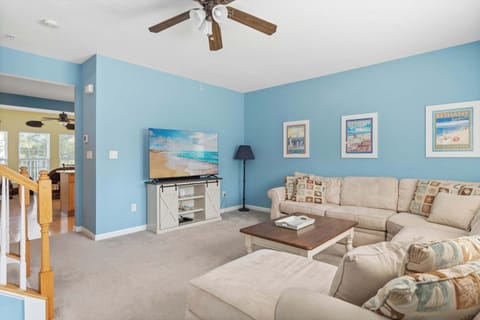 Curl up in the coastal chic living room & stream your favorites on the smart TV​