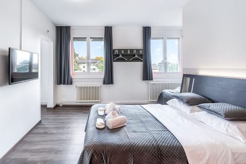 Family Quadruple Room, Multiple Beds, City View | Free WiFi, bed sheets