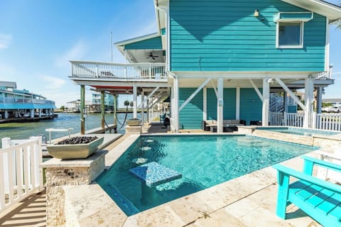 Poolside paradise! Take a dip in the pool or soak your cares away in the hot tub. 