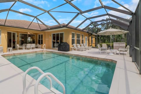 Enjoy the very best of the Florida living in this home, complete with a heated pool and expansive, fully screened, outdoor living space