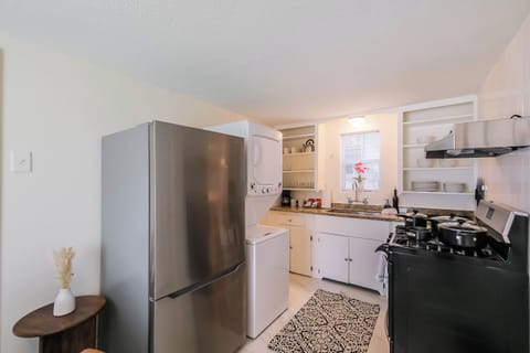 Back House Fully equipped kitchen with modern appliances, cookware, and utensils, ready for any culinary need.