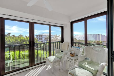 Open up the sliders on the balcony to let in the island breeze - Welcome to Bay Village 203