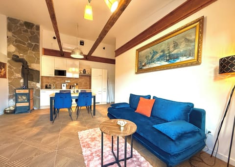 Deluxe Apartment, 1 King Bed with Sofa bed | Living area | Fireplace