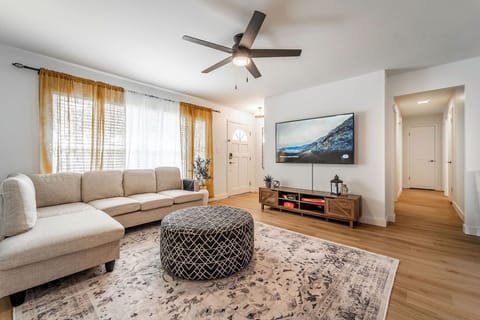 Cozy, family oriented living room with roomy sectional, comfortable and bright