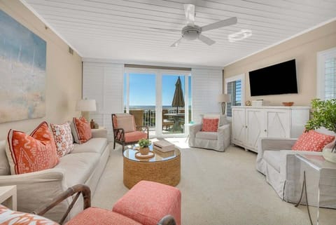 Saint Simons Grand #325 Living space with sofa set, chairs, fan, and beach view balcony access